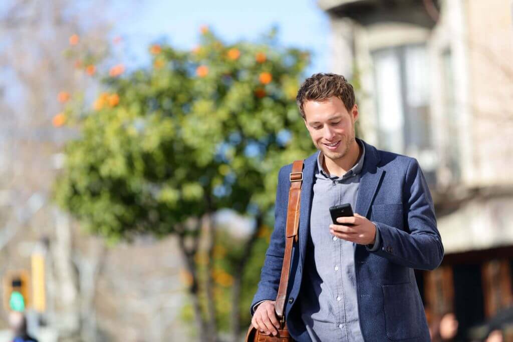 man walking with phone